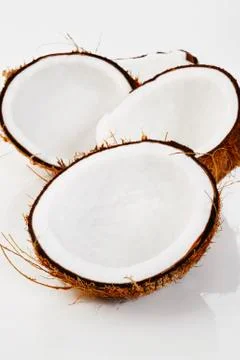 Cut coconut on white background Stock Photos