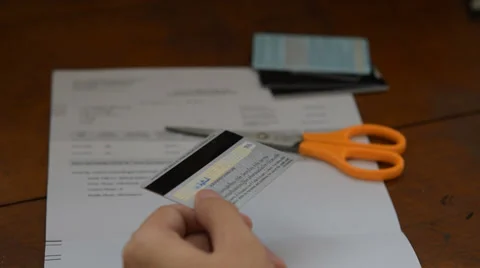 Cut creditcard on table Stock Footage 39715512