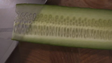 Cut a cucumber with a sharp knife. Close up. Stock Footage 143171670