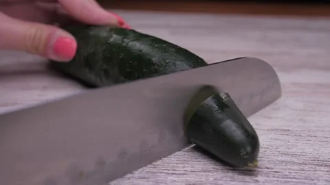 Cut cucumber vegetable with knife  Video stock 150458153