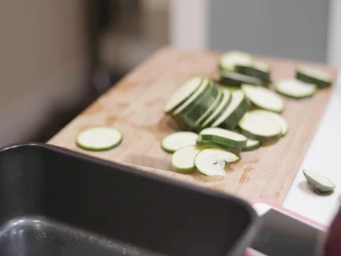Cut up cucumbers in slow motion Stock Footage 80544178