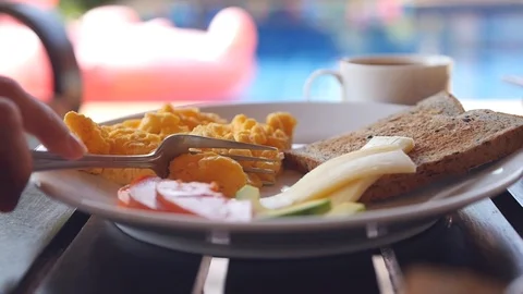 Cut a delicious omelette on a plate with a fork. Slow motion. HD, 1920x1080 Stock Footage 88400054