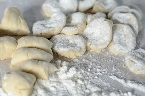 The cut dough to floured rolling. Making of pierogi with Cherry. Stock Photos