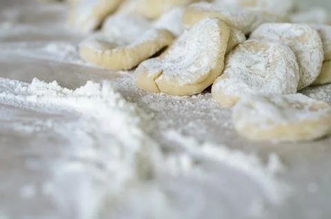 The cut dough to floured rolling. Making of pierogi with Cherry. Stock Photos