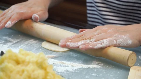 Cut the dough into small pieces. Cooking dumplings with potatoes. Stock Footage 99401649