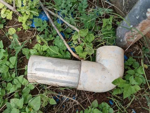 Cut down pipe lying on the farm Stock Photos