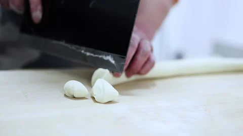 Cut dumpling stuffing and make dumplings Stock Footage 198982617