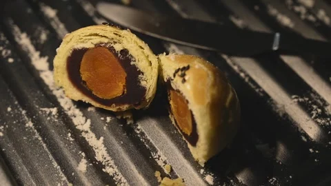 Cut Egg Yolk Pastry Served with Tea for Mid Autumn Festival Stock Footage 345669834