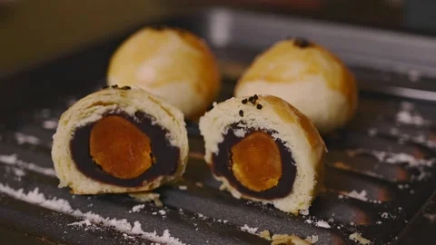 Cut Egg Yolk Pastry Served with Tea for Mid Autumn Festival Stock Footage 345669847