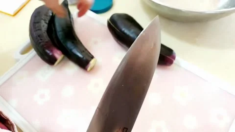 Cut the eggplant in half Stock Footage 204838583