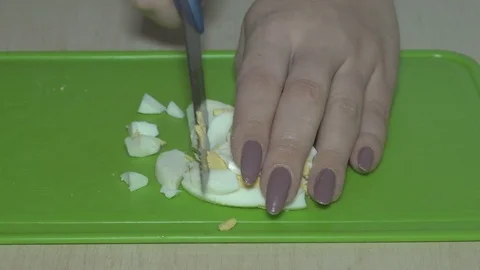 Cut the eggs with a knife Stock Footage 83623767