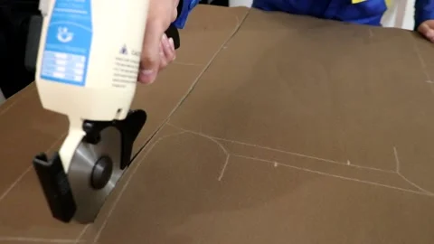 Cut the fabric of the sofa , 3 Shots Stock Footage 147364574