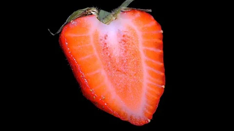 Cut Fresh Strawberry on Black Background – close up, detail Stock Footage 90804092