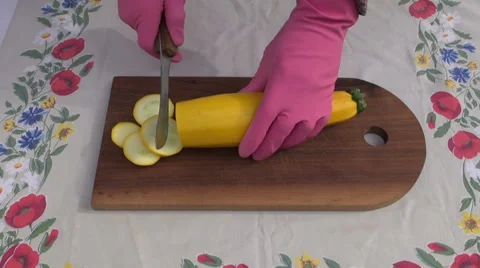 Cut fresh zucchini vegetable slice on  board with knife Stock Footage 28392914