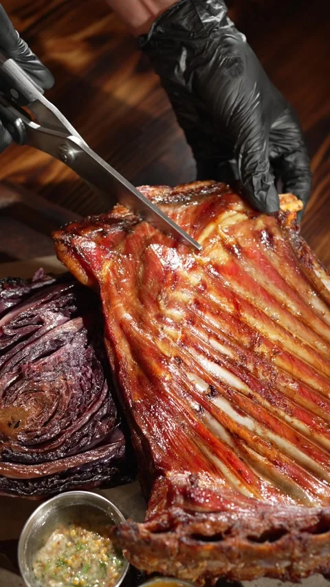 Cut the fried ribs with kitchen scissors Stock Footage 248759265