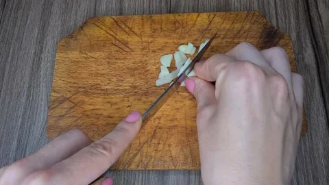 Cut Garlic With A Knife. Stock Footage 166794140