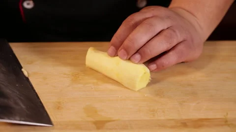 Cut ginger with a kitchen knife Stock Footage 202157056