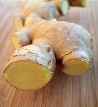 Cut ginger root macro Stock Photos
