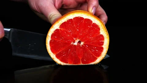 Cut grapefruit into slices Video stock 174094417