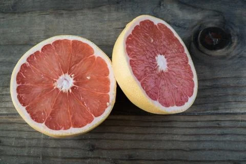 Cut Grapefruit on Wooden Table Stock Photos