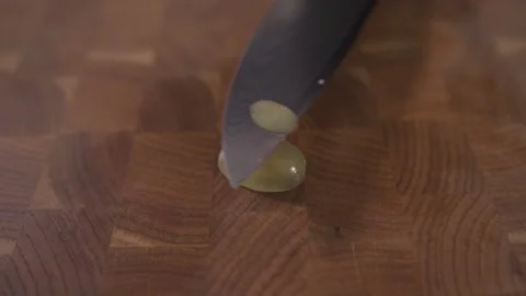 Cut the grapes with a sharp knife. Close up. Stock Footage 143171667