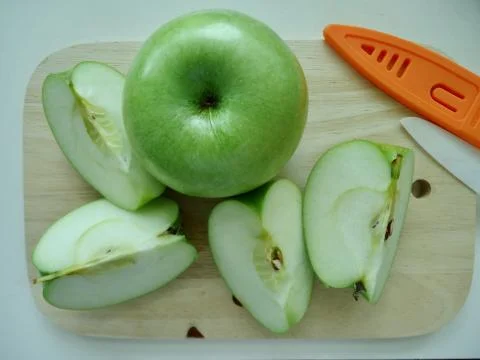 Cut green apple Stock Photos