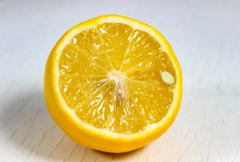 Cut off half of a lemon close-up. Stock Photos