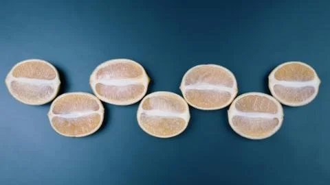 Cut in half lemons on a dark background. useful vitamin food. Stock Photos