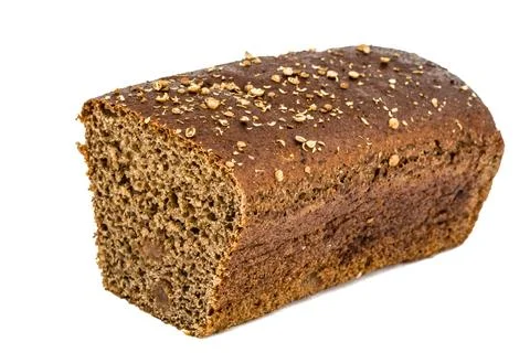 Cut in half a loaf of bread made of dark flour, isolated on white background Stock Photos