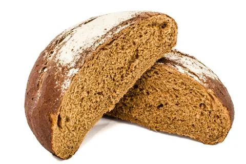 Cut in half a loaf of fresh bread, isolated on white background Stock Photos