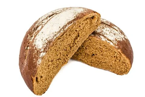 Cut in half a loaf of fresh bread, isolated on white background Stock Photos