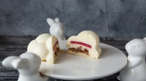 Cut in half Mousse cake in the form of a delicate white cloud. Stock Photos