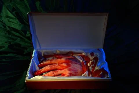 Cut hand in gift box Stock Photos
