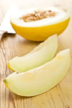 Cut honeydew melon Stock Photos