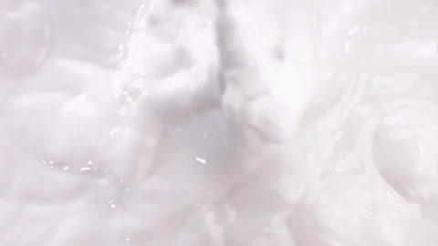 Cut the kiwi fruit and drop it into milk，slow motion Video stock 248406785