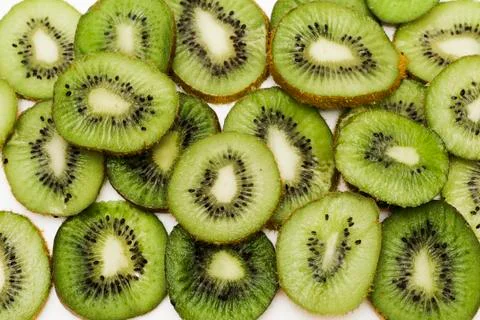 Cut kiwi fruit. Close-up background texture Stock Photos