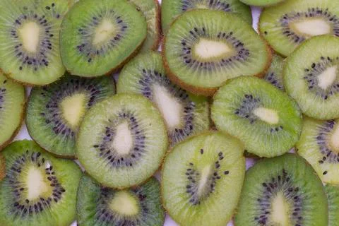 Cut kiwi fruit. Close-up background texture Stock Photos