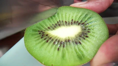 Cut the kiwi on the table Stock-Footage 135513475