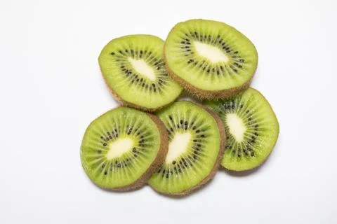 Cut kiwi on white background Stock Photos
