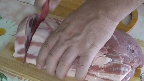 Cut a large piece of raw pork C2001 4k Stock Footage 112832152