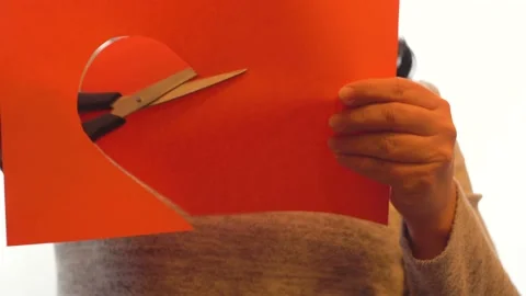 Cut a large red heart 4K Stock Footage 102443768