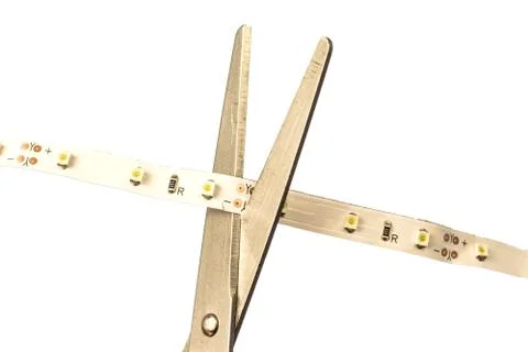 Cut LED strip with scissors Stock Photos
