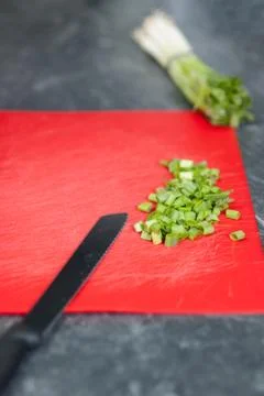 Cut leek on kitchen bench Stock Photos