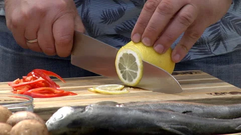 Cut lemon with a knife Stock Footage 114583463