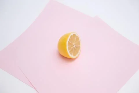 Cut lemon on pink background Stock Photos