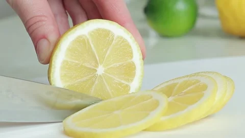 Cut lemon into slices Stock Footage 242167851