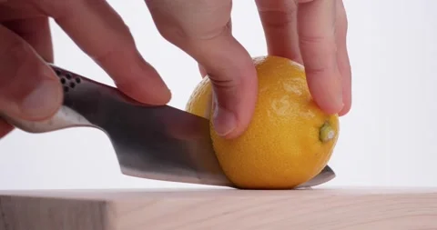 Cut lemon in two. Stock Footage 231657733
