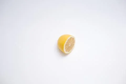 Cut lemon on white surface Stock Photos