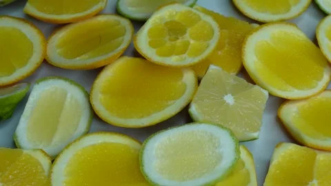 Cut up lemons and oranges rotate. C0377 Stock Footage 255573866