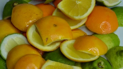 Cut up lemons and oranges rotate. C0379 Stock Footage 255574192